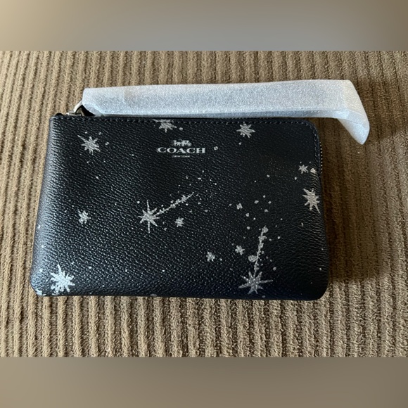 Coach Handbags - Coach Corner Zip Wristlet
With Star Print NWT w/packaging